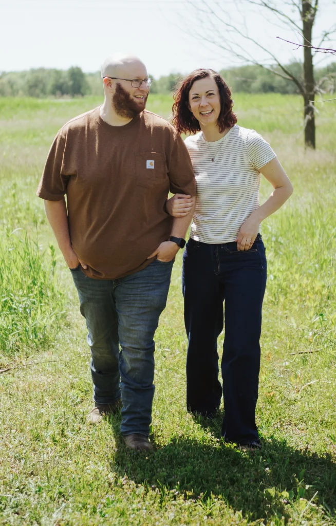 Marissa and Barnabas walking through their field